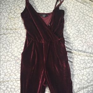 Red velvet jumpsuit with side pockets